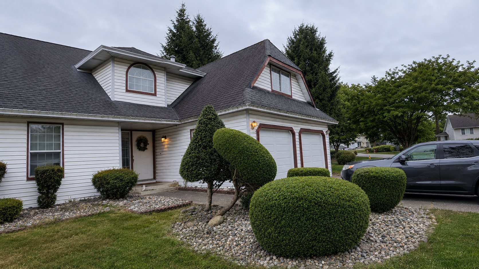 Crisp, sculpted hedges and clean beds after Ironwood Grounds hedge trimming and topiary