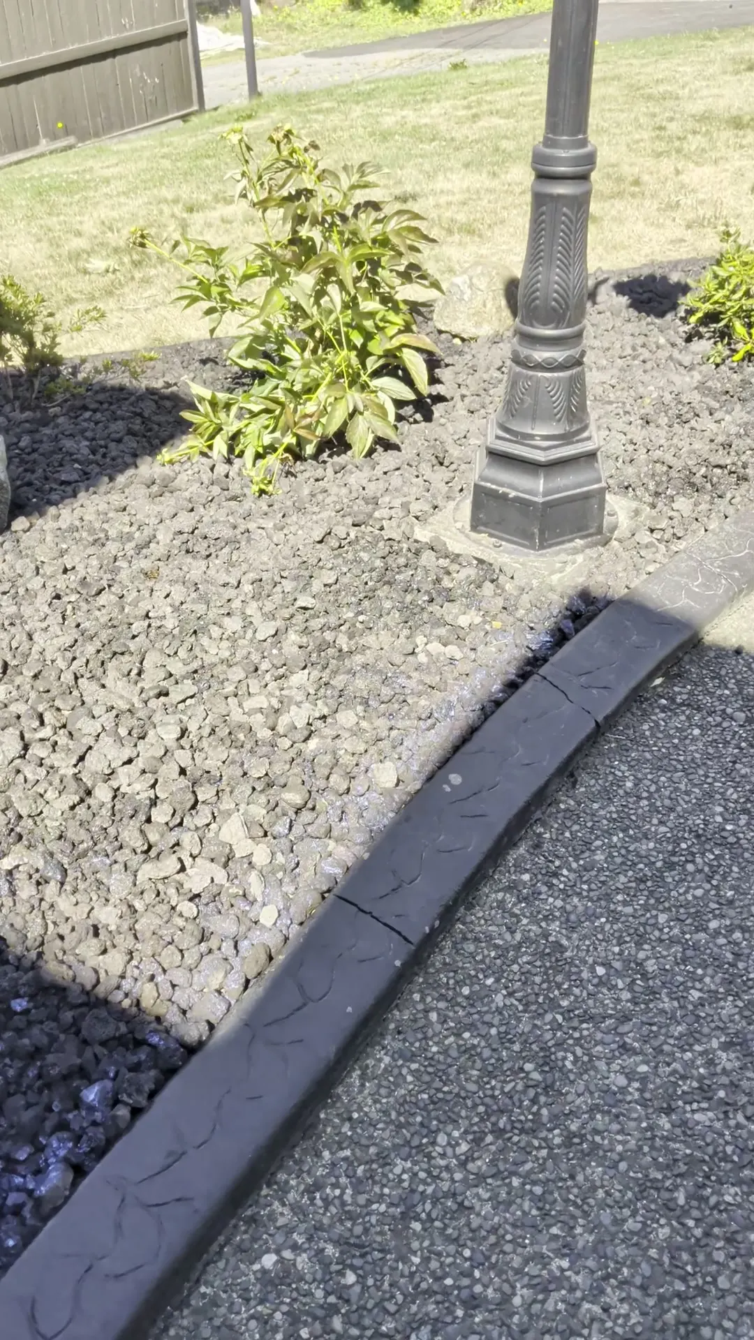 A cleaned garden bed with restored curb line after an Ironwood Grounds grounds care visit